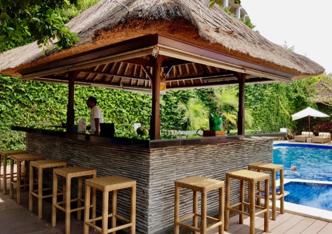 The pool bar is popular during happy hours.