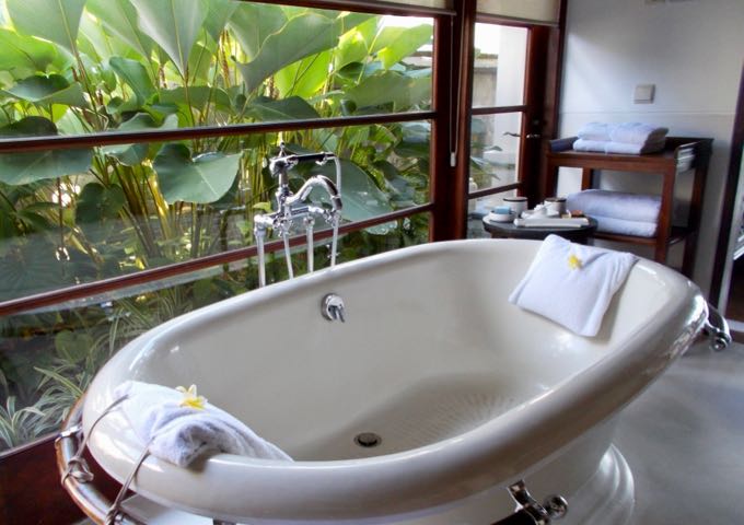 The villa bathrooms offers excellent views of private gardens.