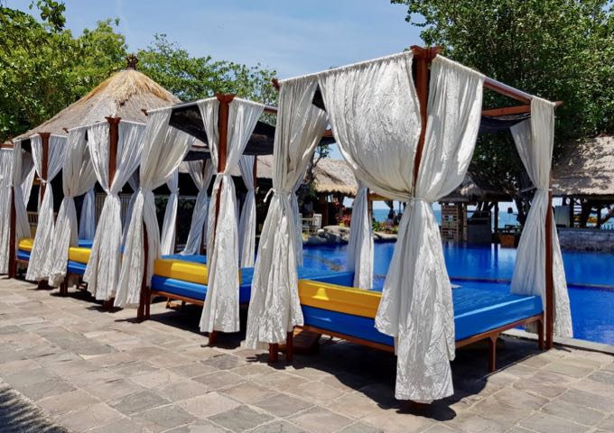 There are several comfortable cabanas around the pool.