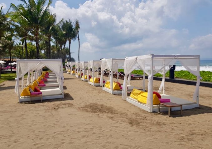 There is a raised area with imported white sand and daybeds for resort guests.