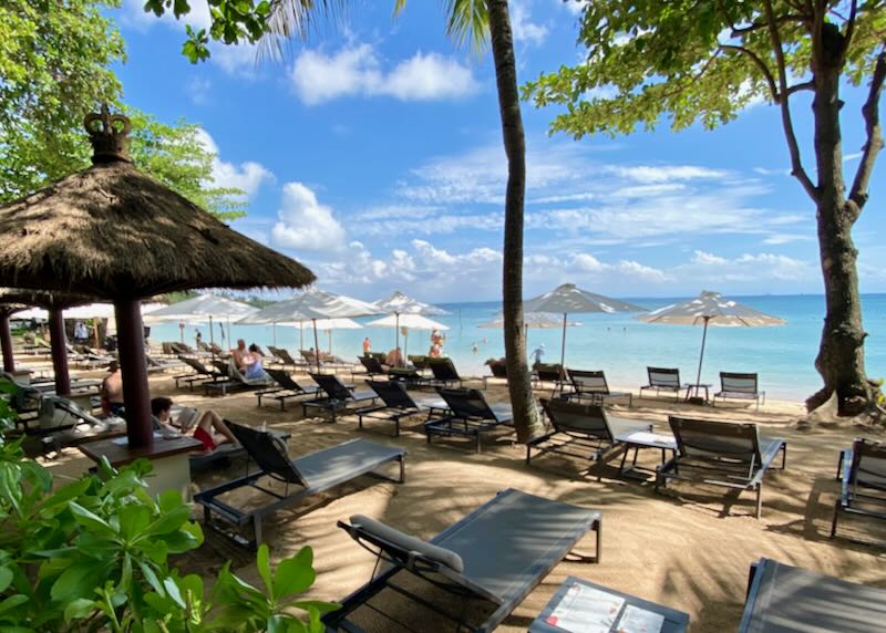 Lounge chairs line the beach at Melia Bali in Nusa Dua