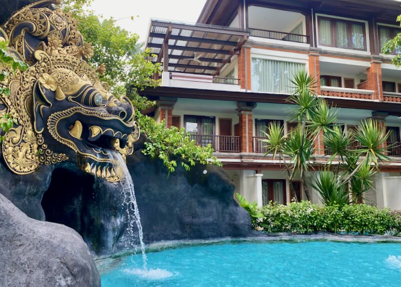 A dragon fountain fills the pool at Padma Resort Legian in Bali.
