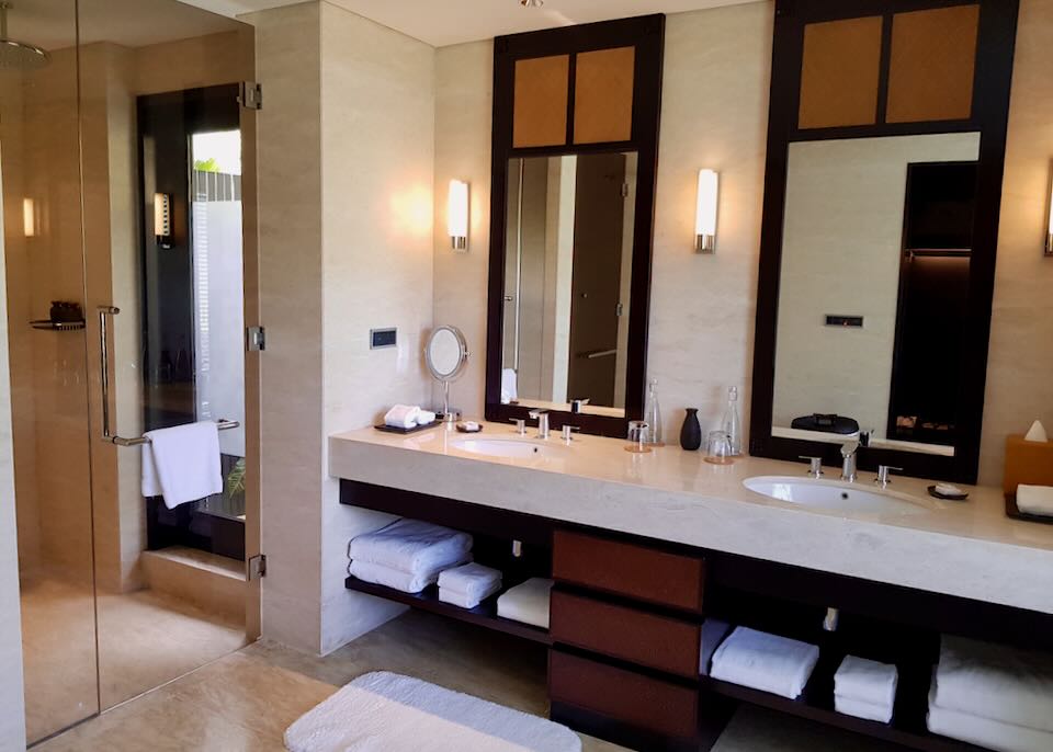 A walk-in shower and double sinks line the Presidential Villas bathroom.