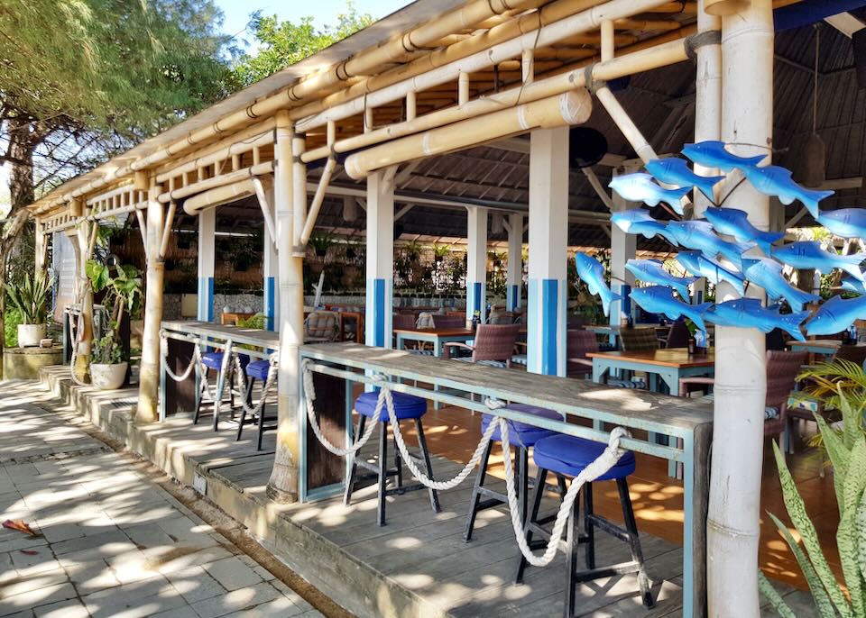 An open-air bar sits next to the beach.