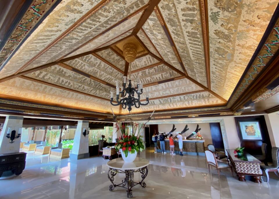 A painted ceiling hangs over the Ayana lobby.