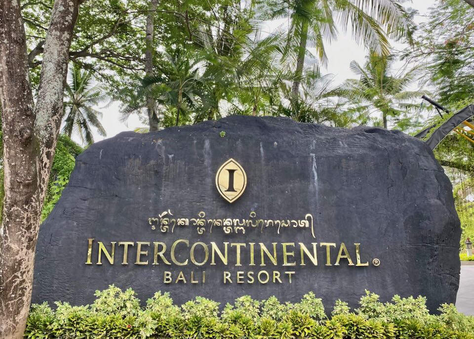 A dark grey stone with gold lettering reads, "Intercontinental Bali Resort"