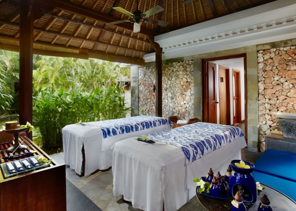 Two massage beds sit in a room at the spa.