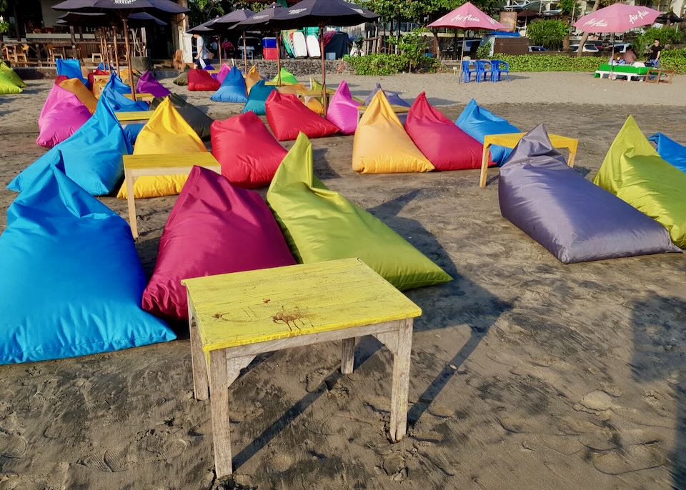 Colorful beanbags on the beach.