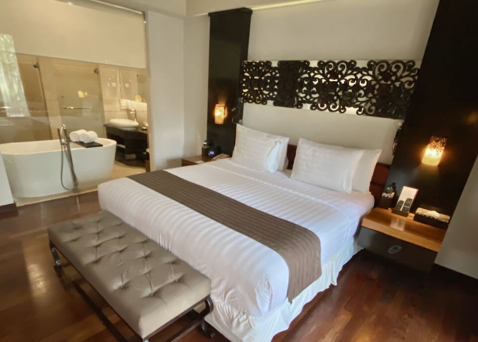 A king-sized bed sits in the room at The Seminyak