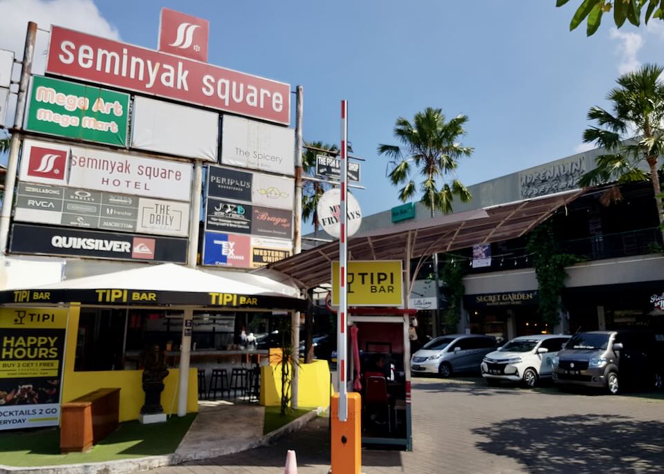 A sign advertising all the stores at Seminyak Square mall.