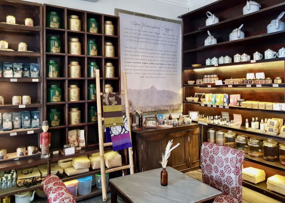 Shelves of jars line the walls of a tea and coffee house.