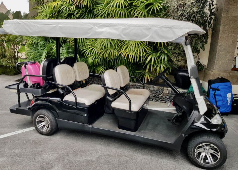 A large golf cart that seats 6 people.