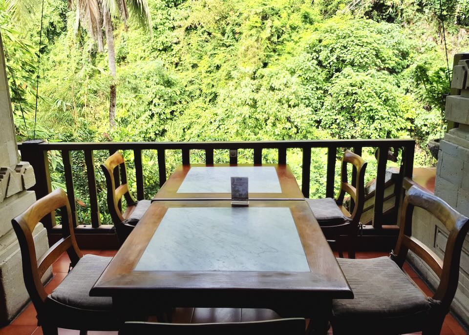Tables with a jungle view at Murni's Warung restaurant.