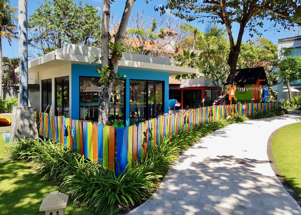 A colorful picket fence encloses the kids club.
