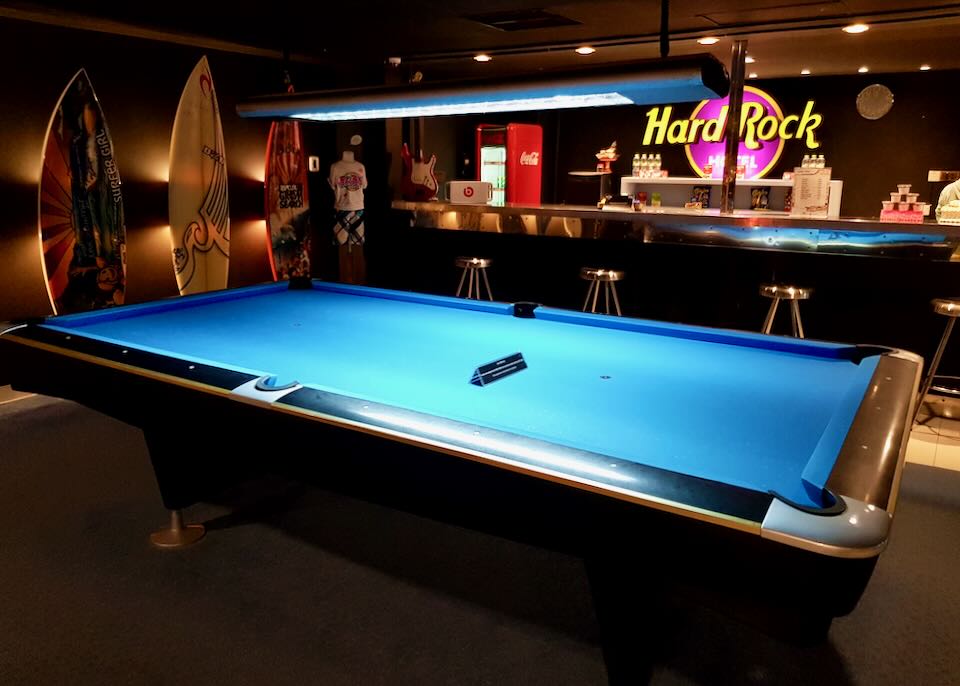 A pool table in a lounge.