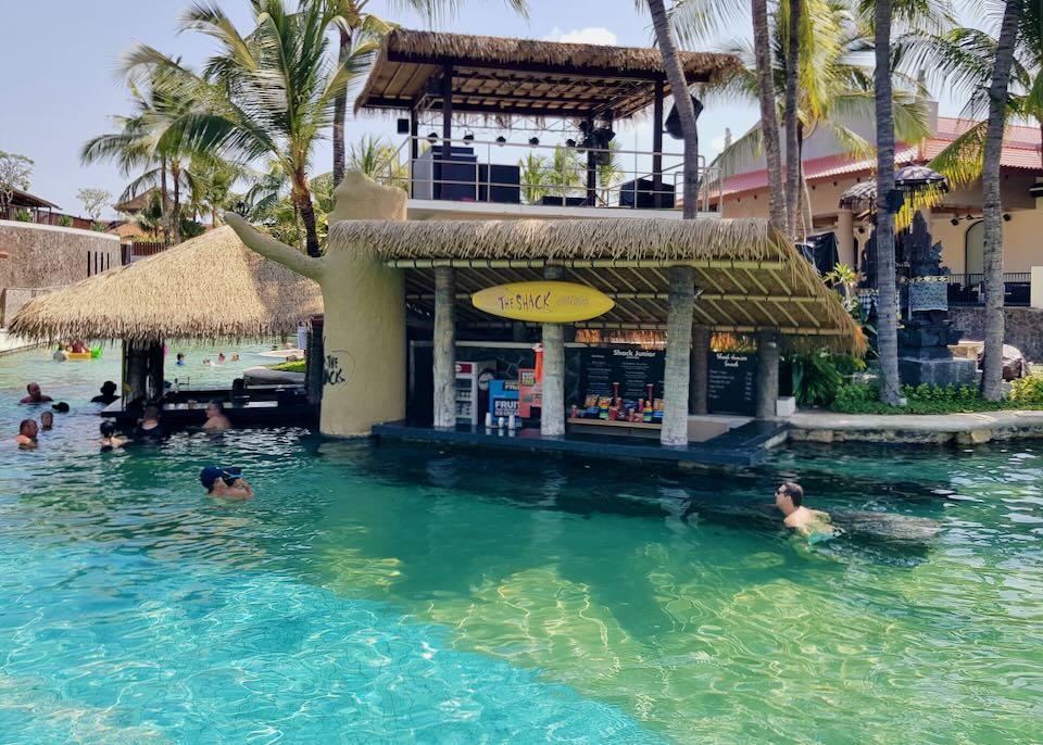 Guest swim up to The Shack bar in the pool.