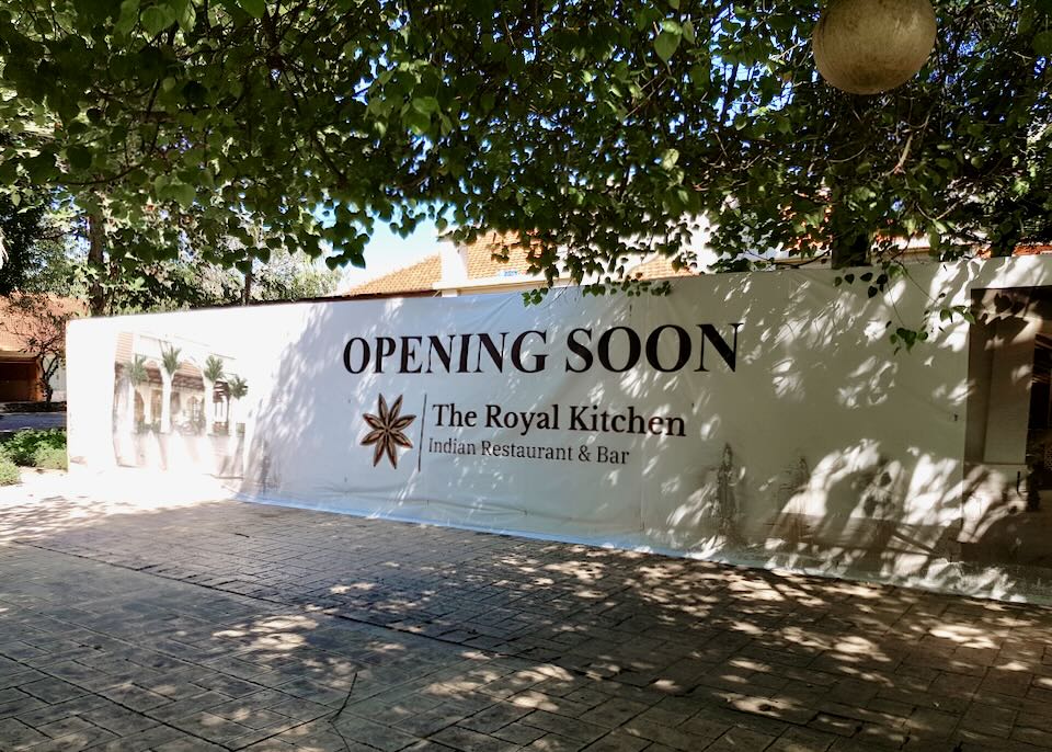 An opening soon sign for The Royal Kitchen.