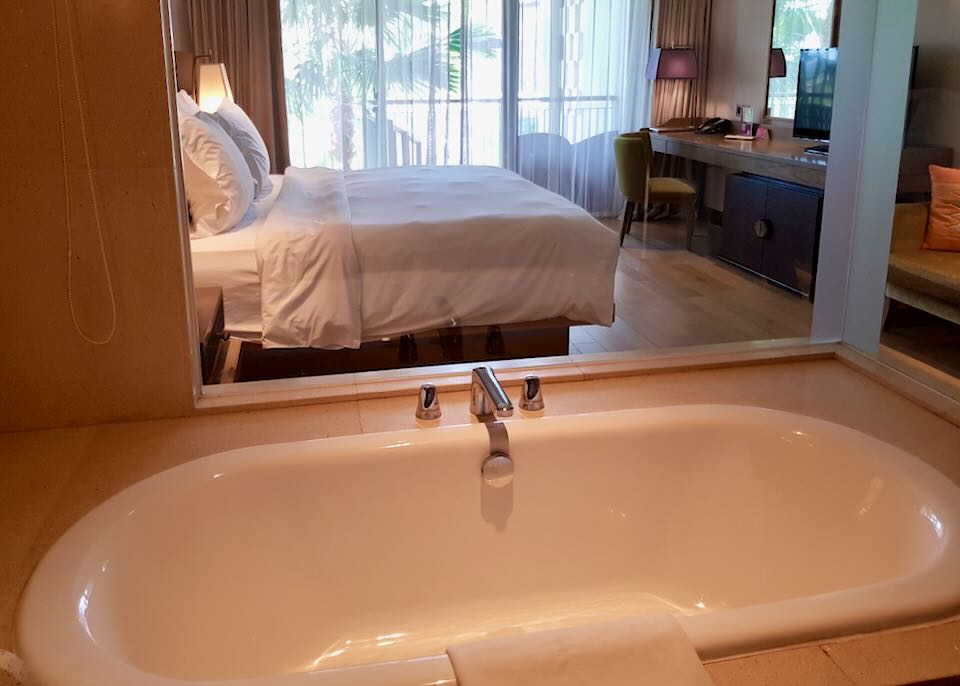 A bathtub looks into the room.