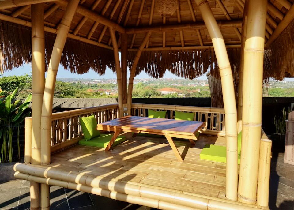 A bamboo deck with a thatched roof.