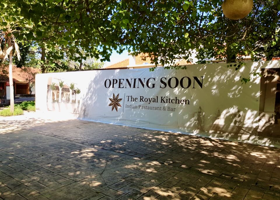 A banner outside reads, "Opening Soon."