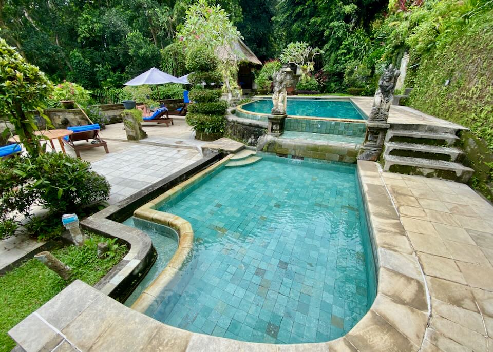 Two pools sit on a patio.