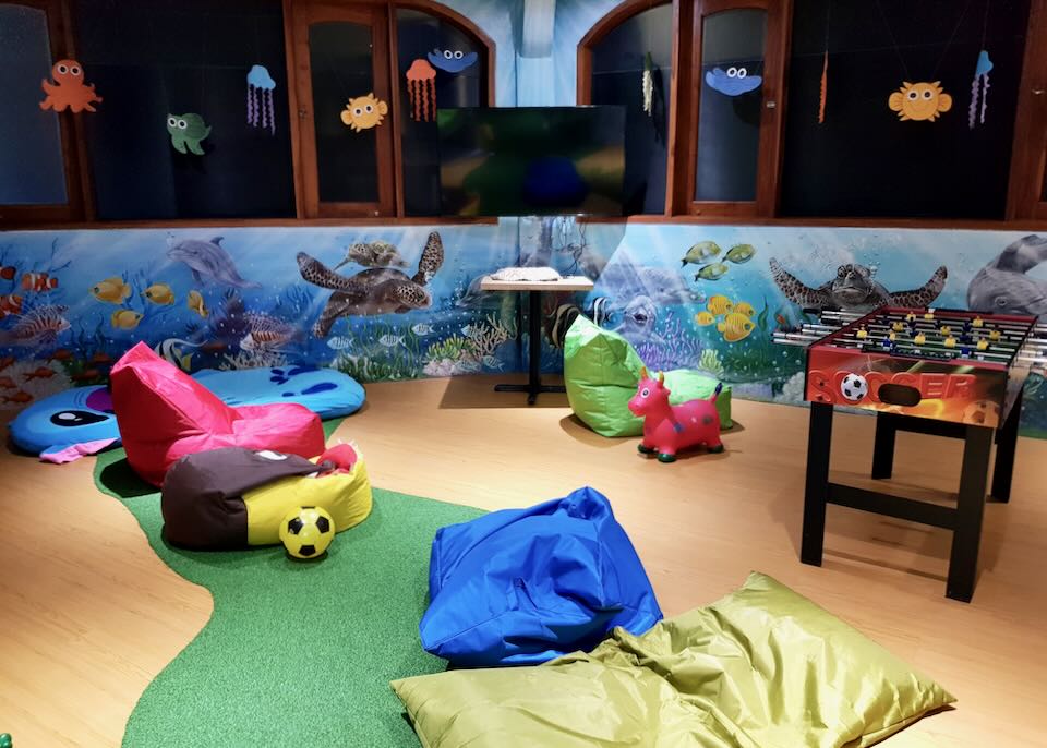 Colorful beanbags sit in the Kids Club.