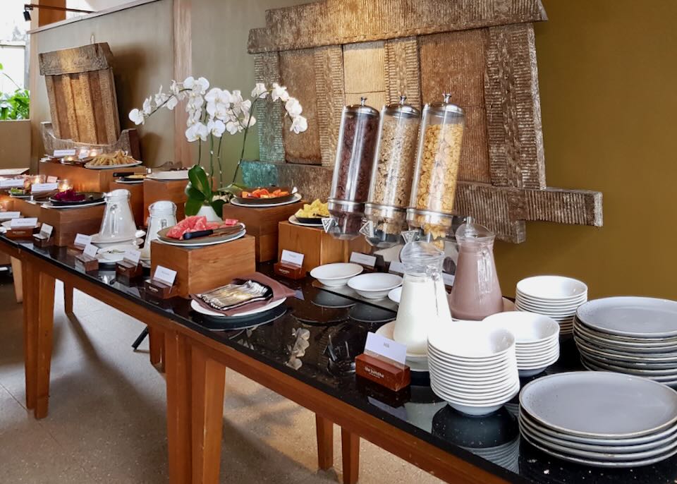 Food is laid out on a buffet table for breakfast.