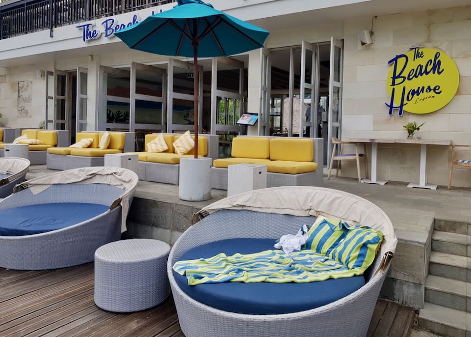 Outdoor lounge chairs sit on a deck at The Beach House.