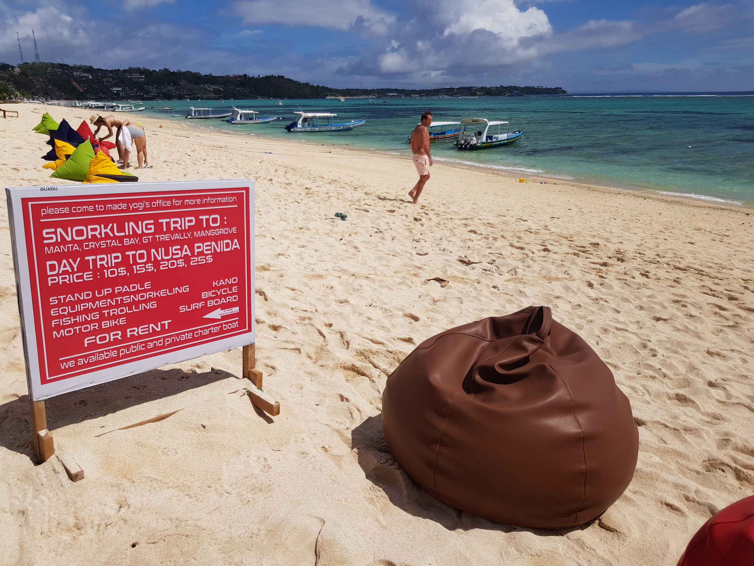 An snorkling advertising sign on the beach