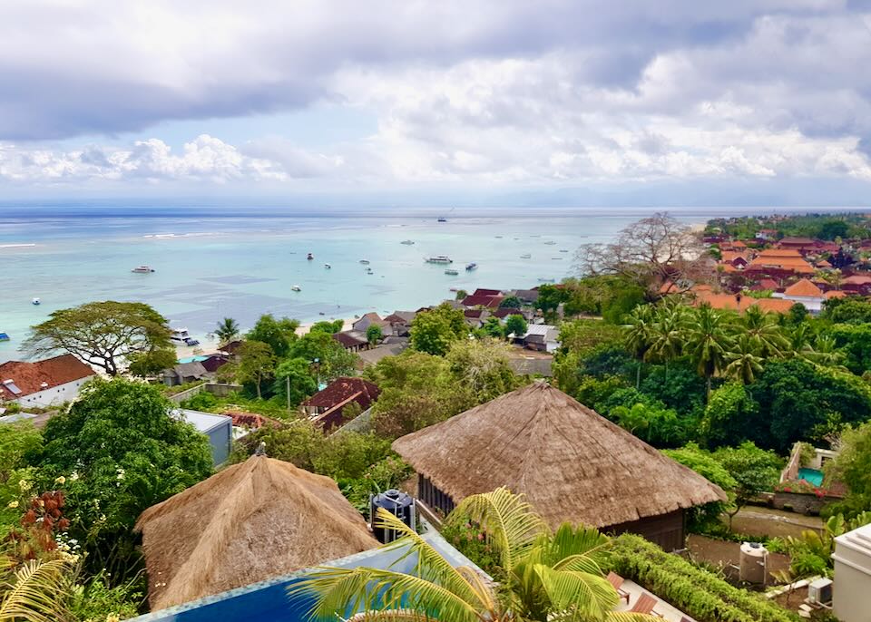 A view of the thatched roofs and ocean from a balcony at the villa.