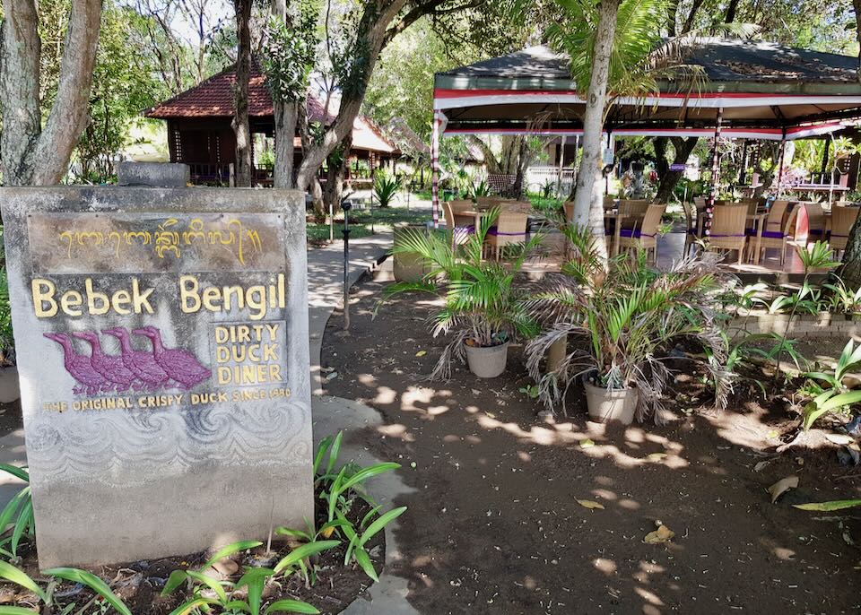 A stone sign reads, "Bebek Bengil Dirty Duck Diner."