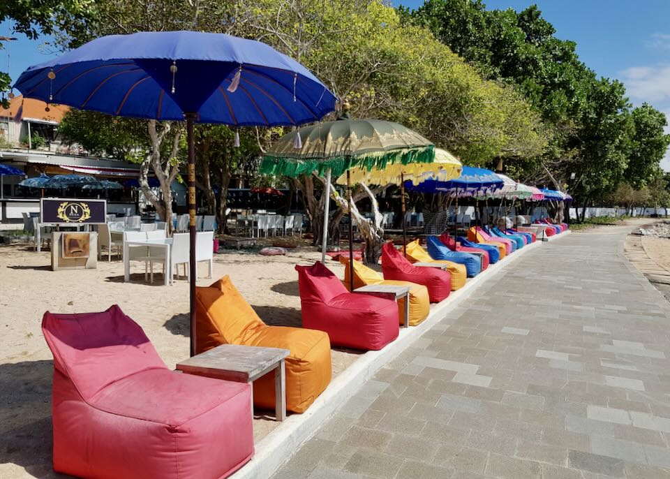 Colorful beanbags sit along the paved path.