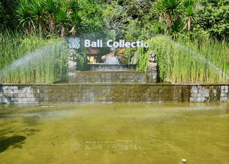 A large sign in a fountain reads, "Bali Collection."