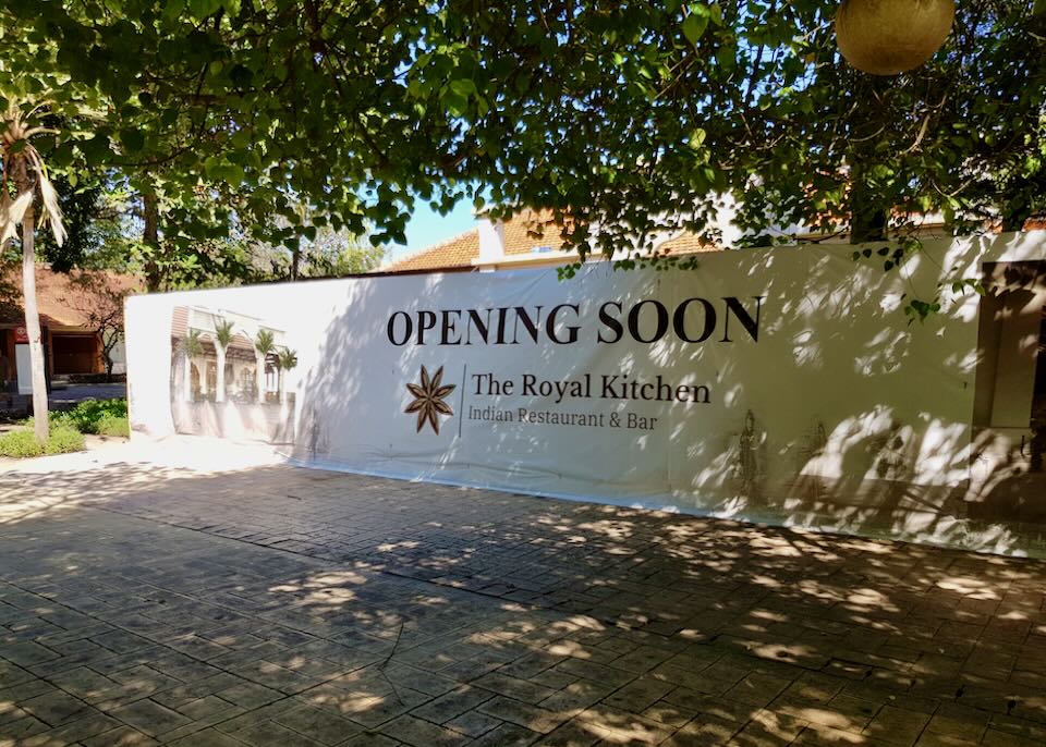 An outdoor sign reads, "Opening Soon."